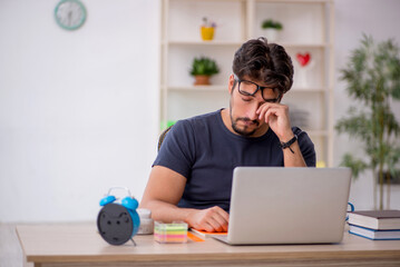 Young male designer working in the office