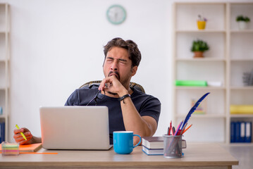 Young male designer working in the office