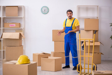 Young male contractor doing home relocation