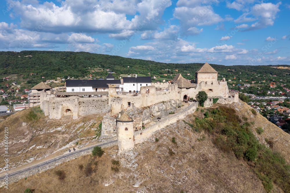 Poster aerial view of sumeg castle with newly restored gothic palace building and corner gun bastion under 