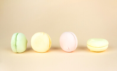 Beautiful variety of marshmallows looks like macaroons on pastel pink background.