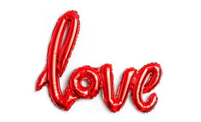 Love word from red balloon on white background. Valentine's Day. The concept of romance. Declaration of love. Copy space for text.