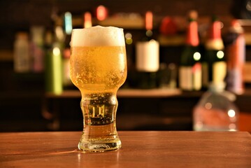 glass of beer on wooden table