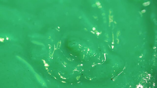 Syrupy sticky dripping mint green slime