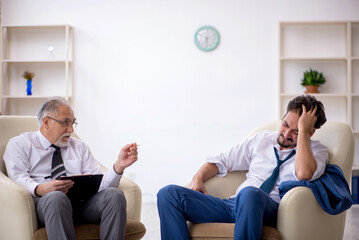 Young businessman employee visiting psychologist