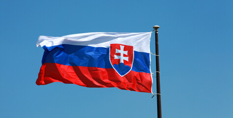 waving in the wind the flag of the state of Slovakia