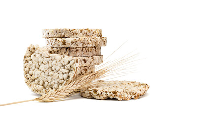 Fitness crispbread with ears of wheat isolated on white background. Healthy diet food. Whole grain crispy bread. Diet bread.