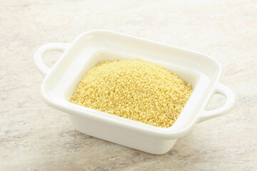 Raw couscous in the bowl