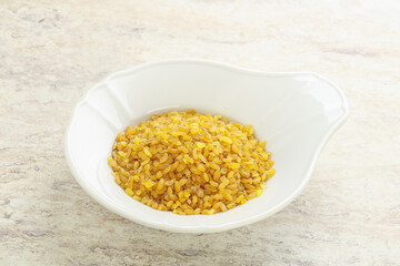 Raw bulgur in the bowl