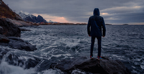 silhouette of a person standing on the sea