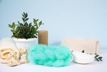 washcloth with white soap. Blue background.