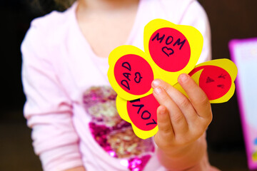 Child  making fun Valentine cards, funny crafts