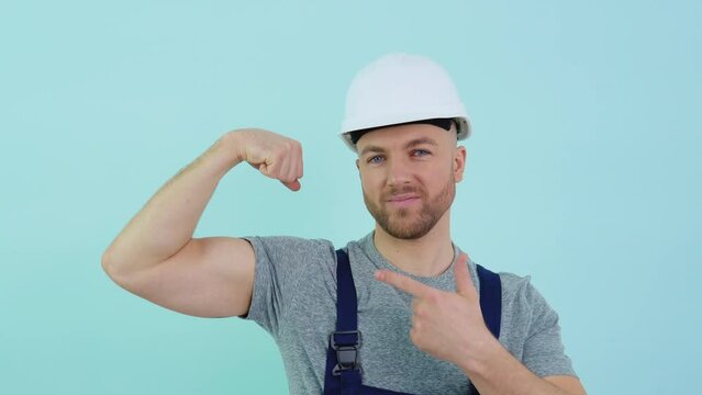 Repairman in overalls showing biceps