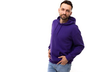 stylish portrait of a charismatic man in a blue purple hoodie on a white background