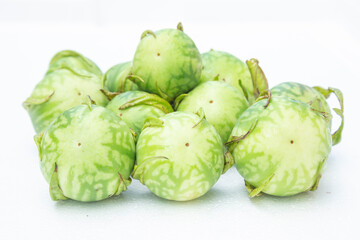 fresh Thai pea aubergines ( pea eggplant ) also known as Thai round eggplants.