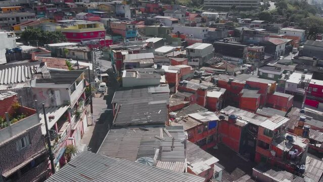 Aerial landscape image - Flying over slum subway rail in district of Capão Redondo, São Paulo City in Brazil