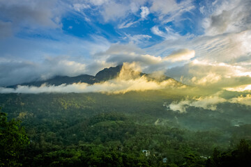 Beautiful mountain landscape with Sunrise and passing clouds. Munnar, Kerala, India