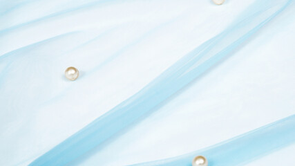 blue elastic fatin fabric tulle mesh with pearls. fashion blog concept.