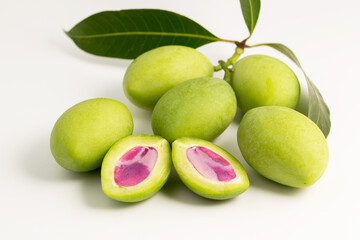 Close-up raw marina plum or green plum mango with purple seed asia tropical fruit sour taste.