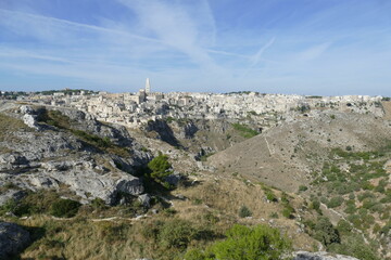 Fototapeta na wymiar panorama on Matera and on the canyon carved by the Gravina River from Murgia Materana Park viewpoint