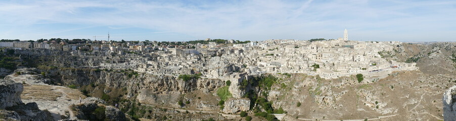 Fototapeta na wymiar panorama on Matera and on the canyon carved by the Gravina River from Murgia Materana Park viewpoint