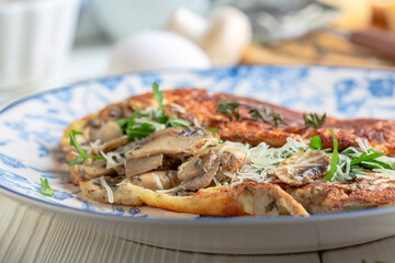 Omelet with mushrooms and cheese.