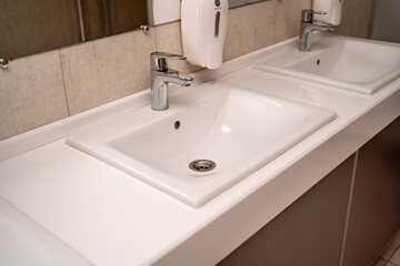 Public sinks, Handwashers for people using public toilets, Cleaning after using the toilet service, Public toilets and hygiene concept.