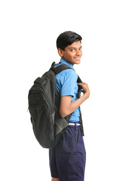 Indian School Boy Standing On White Background.