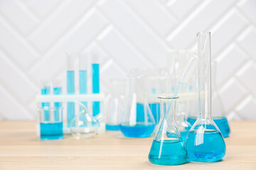 Laboratory glassware with test tubes. flasks, dropper, petri dishes, measuring cups and cylinders for scientific laboratories,