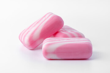 Pieces of pink soap isolated on white background