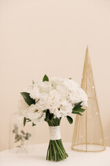 Beautiful white bridal bouquet of roses, chrysanthemums, eustoma