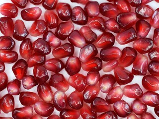 Fresh pomegranate seeds close up, natural background