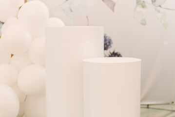 White tube - a table for the presentation of products and a table decoration near the photo zone, decor for events