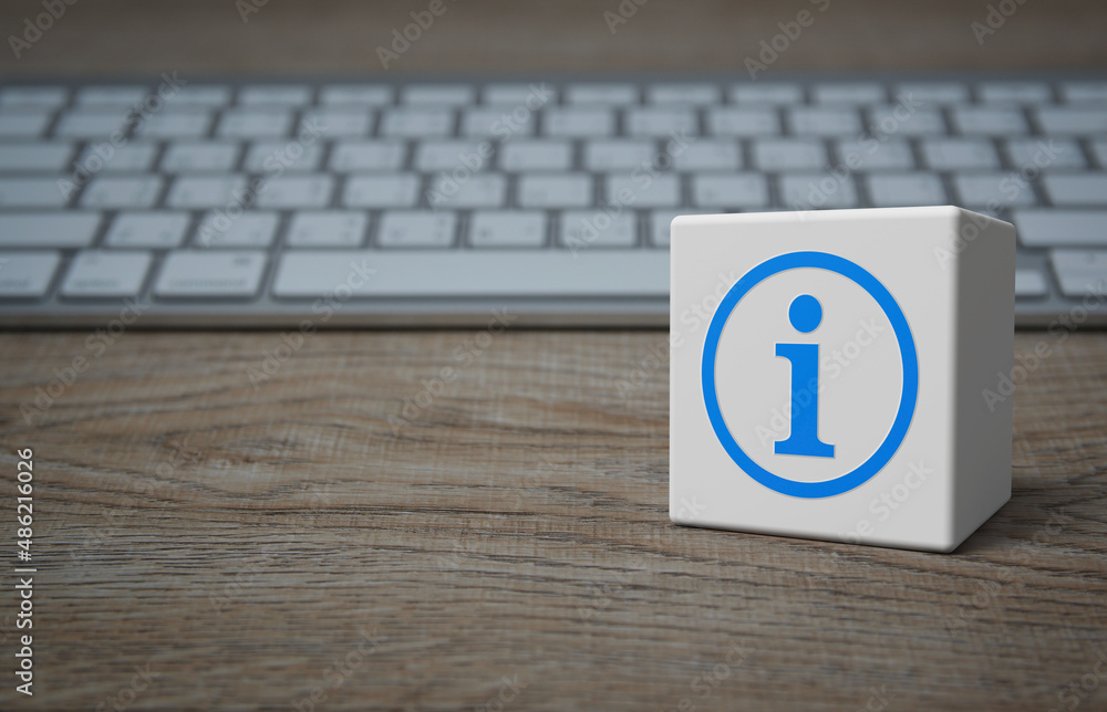 Poster Information sign flat icon on white block cube with modern computer keyboard on wooden table, Business customer service and support online concept