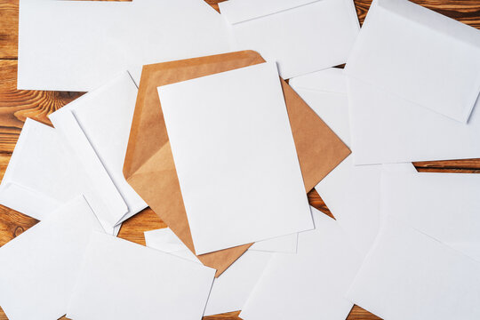 Stack Of Envelopes On Working Desk Top View. Business Mail