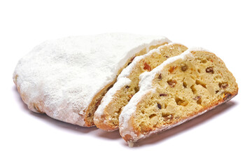 Sliced Traditional Christmas stollen cake with marzipan and dried fruit isolated on white background