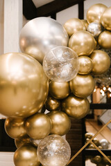 The round photo zone is decorated with gold and silver birthday balls, the work of an aerodesigner,...