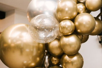 The round photo zone is decorated with gold and silver birthday balls, the work of an aerodesigner, close-up