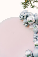 Round pink photo zone made of silver balloons with space to copy your text. Party decorated with balloons