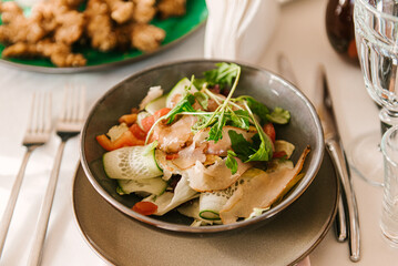 Beautifully decorated catering banquet table with different food snacks and appetizers with sandwich, fresh fruits on corporate party event or wedding celebration