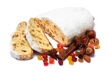 Sliced Traditional Christmas stollen cake with marzipan and dried fruit isolated on white background