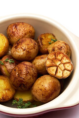 Baked potato in a clay pot isolated on white background