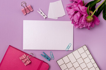 Female Desktop with White Keyboard and Pink Peony and Pink Note Book Top View Mock up Card for Text or Message Hoizotal