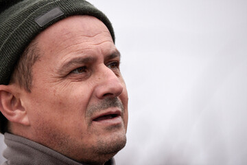 Closeup portrait of a middle aged man with intense look outdoor