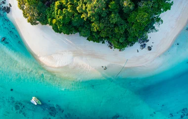 Fototapeten Top view of white sand beach tropical  with seashore as the island in a coral reef ,blue and turquoise sea Amazing nature landscape with blue lagoon © SASITHORN