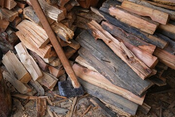 Woodcut, ax and woods. Cutting wood.
