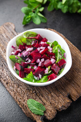 fresh beet salad beetroot, onion, lettuce ready to eat portion dietary healthy meal food diet snack on the table copy space food background 
