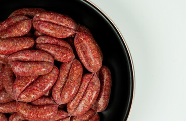 Raw homemade sausages close-up isolate on a white background