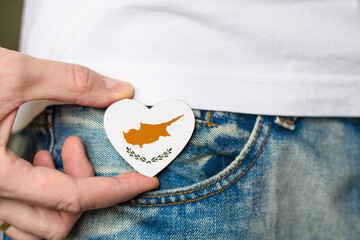 Patriot of the Cyprus! Wooden badge with Cyprus flag in the shape of a heart in a man's hand.