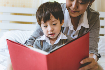 little boy and mom with books, education concept.